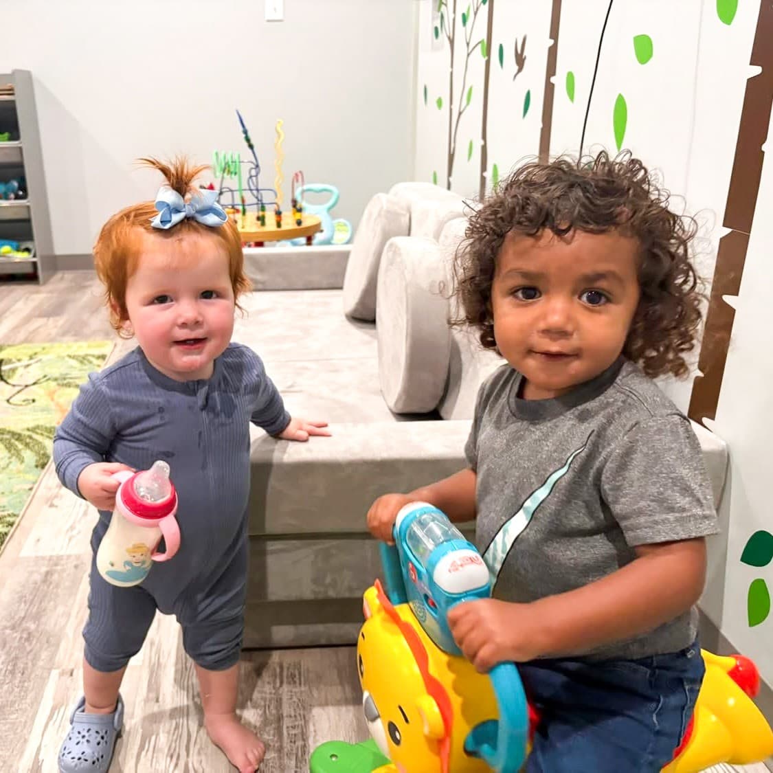 Two toddlers playing in the GCG Minis nursery